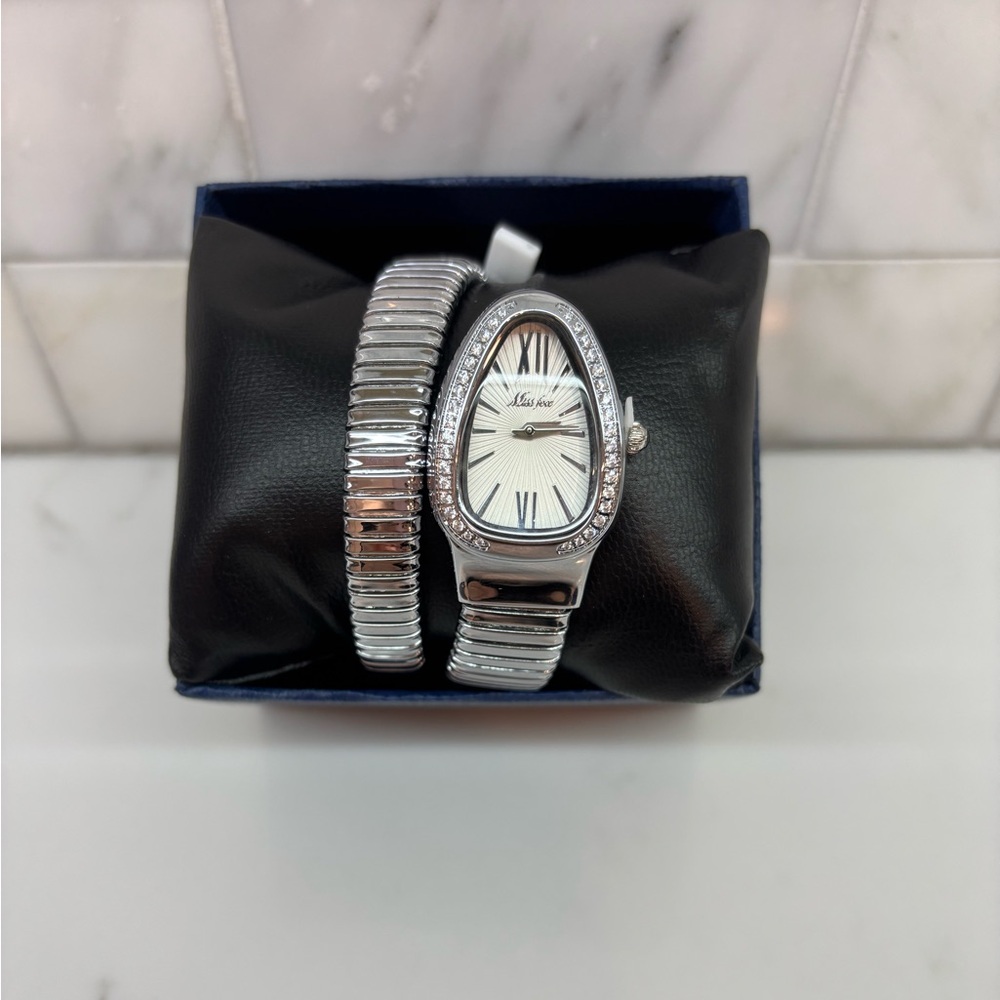 Serpenti style watch, color silver. Brand new with tags. Never worn.